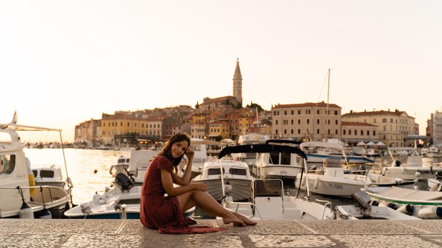 A woman sitting by the sea in Malta